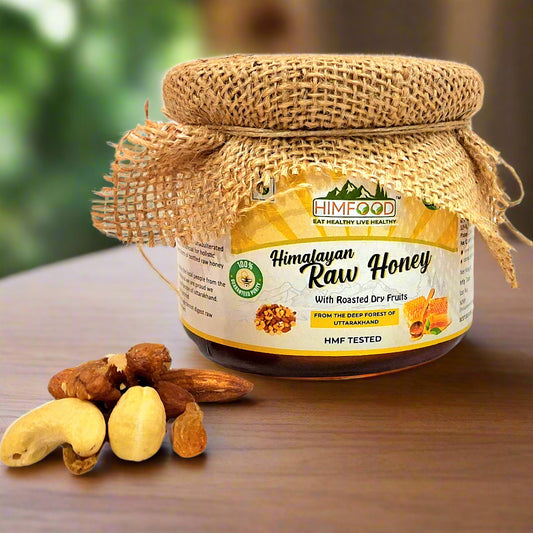 Glass jar of Himalayan Multiflora Raw Honey with visible dry fruits – 400g – natural and nutritious blend