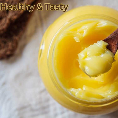 Himalayan Badri Cow Ghee in a jar with a wooden spoon, showcasing its rich texture and golden color.