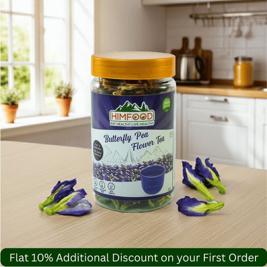 Himalayan butterfly pea flower tea in a jar with dried flowers and a cup, promoting a 10% discount on first order.