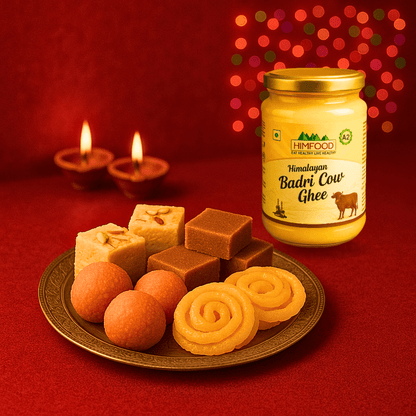 Himalayan Badri Cow Ghee jar displayed with assorted sweets on a festive plate.